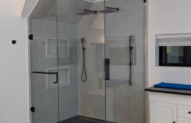 Why are frameless glass shower enclosures popular in Canada? What are the costs involved?