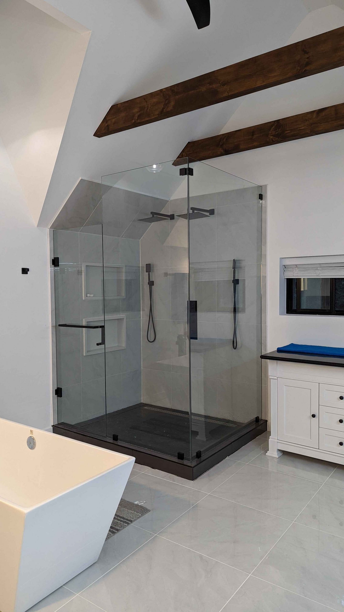 Why are frameless glass shower enclosures popular in Canada? What are the costs involved?
